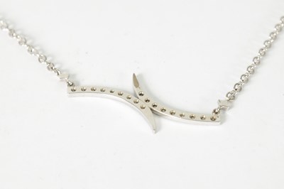 Lot 397 - AN 18CT WHITE GOLD DIAMOND NECKLACE AND BANGLE SET
