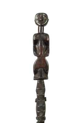 Lot 673 - A 19TH CENTURY AFRICAN TAPERED EBONY WALKING CANE
