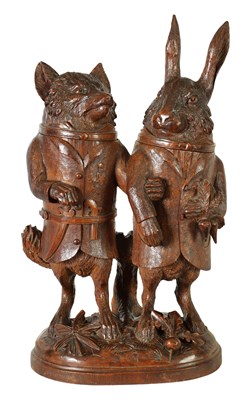 Lot 757 - A LARGE AND RARE 19TH CENTURY BLACK FOREST CARVED LINDEN WOOD TOBACCO JAR FORMED AS A FOX AND HARE