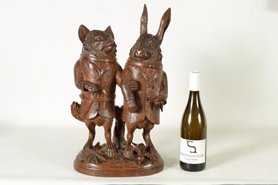 Lot 757 - A LARGE AND RARE 19TH CENTURY BLACK FOREST CARVED LINDEN WOOD TOBACCO JAR FORMED AS A FOX AND HARE
