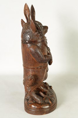 Lot 757 - A LARGE AND RARE 19TH CENTURY BLACK FOREST CARVED LINDEN WOOD TOBACCO JAR FORMED AS A FOX AND HARE