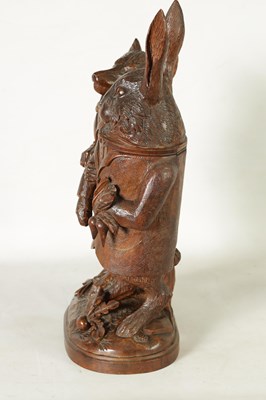 Lot 757 - A LARGE AND RARE 19TH CENTURY BLACK FOREST CARVED LINDEN WOOD TOBACCO JAR FORMED AS A FOX AND HARE