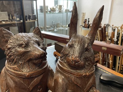 Lot 757 - A LARGE AND RARE 19TH CENTURY BLACK FOREST CARVED LINDEN WOOD TOBACCO JAR FORMED AS A FOX AND HARE