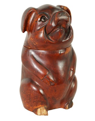 Lot 747 - A 19TH CENTURY CARVED FRUIT WOOD TOBACCO JAR FORMED AS A STANDING PIG