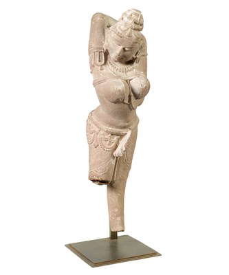 Lot 182 - A 12TH CENTURY CARVED RED SANDSTONE NORTHERN INDIAN APSARA FIGURE
