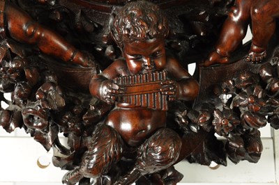Lot 1478 - A FINE 19TH CENTURY ITALIAN CARVED WALNUT HANGING MIRROR