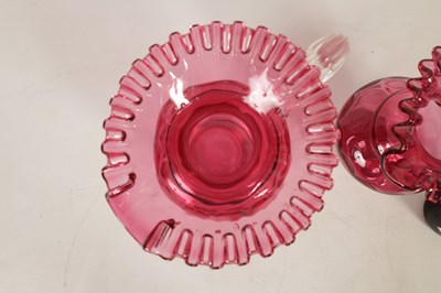 Lot 4 - A GRADUATED PAIR OF 19TH CENTURY STYLE OVERSIZED CRANBERRY GLASS JUGS