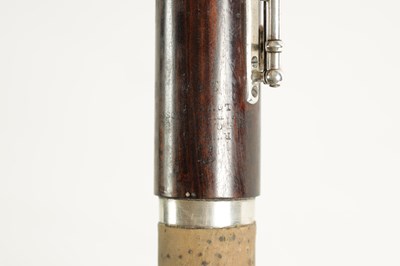 Lot 646 - A MID 19TH CENTURY WOODEN FLUTE BY RUDALL, CARTE & CO. NO. 385.