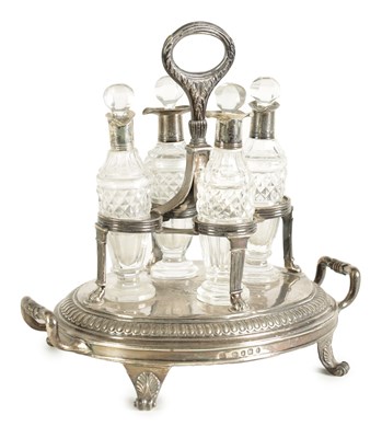 Lot 316 - A GEORGE III FOUR BOTTLE SILVER TABLE CRUET
