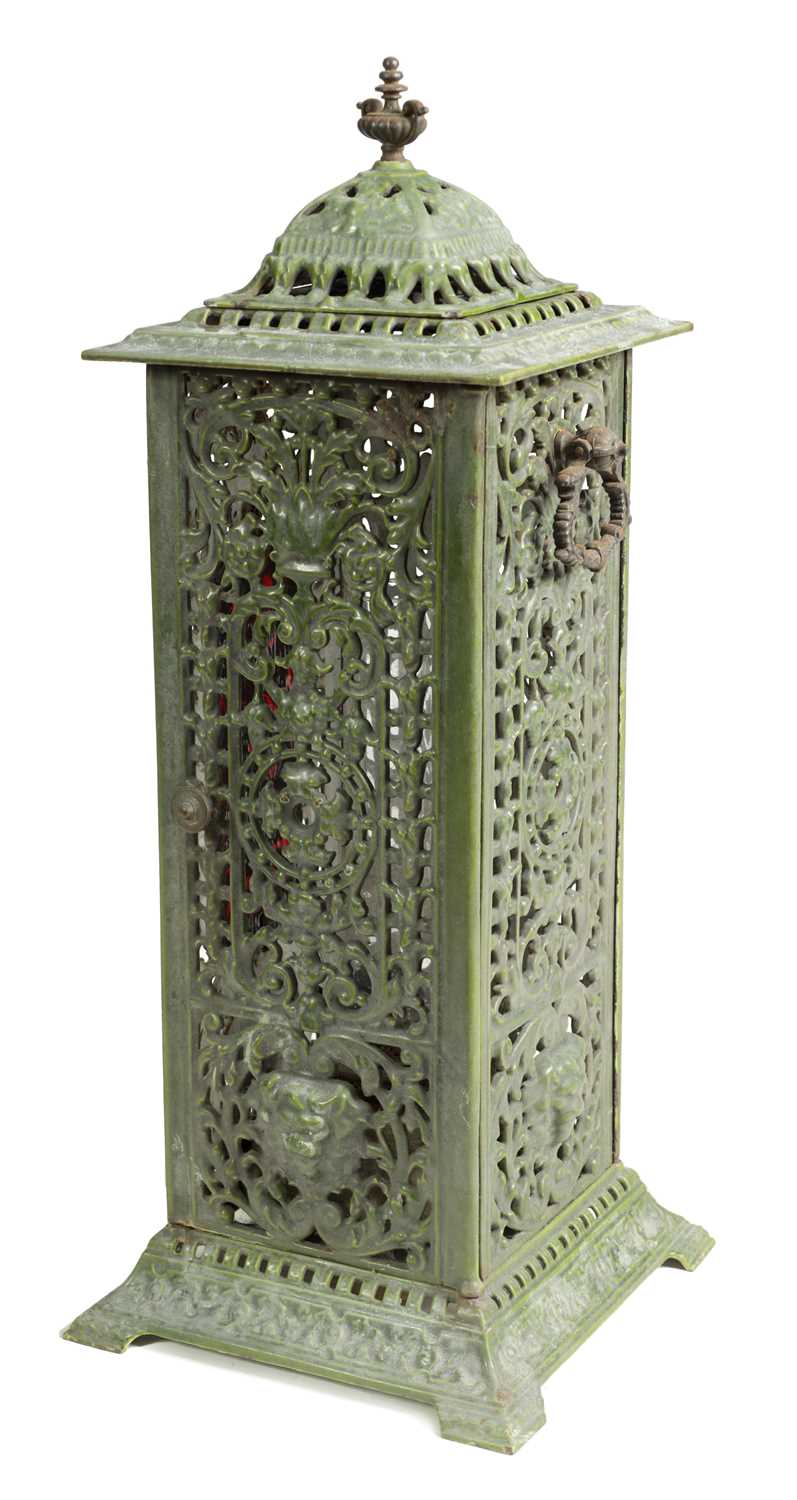 Lot 601 - A 19TH CENTURY CAST IRON OIL BURNER/HEATER