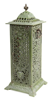 Lot 601 - A 19TH CENTURY CAST IRON OIL BURNER/HEATER