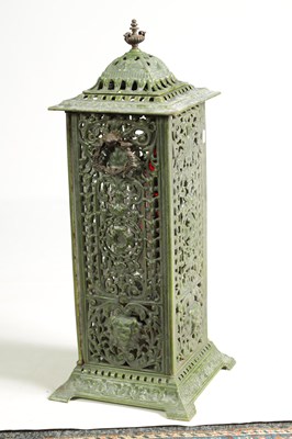 Lot 601 - A 19TH CENTURY CAST IRON OIL BURNER/HEATER