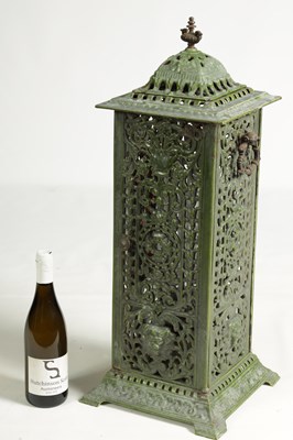 Lot 601 - A 19TH CENTURY CAST IRON OIL BURNER/HEATER