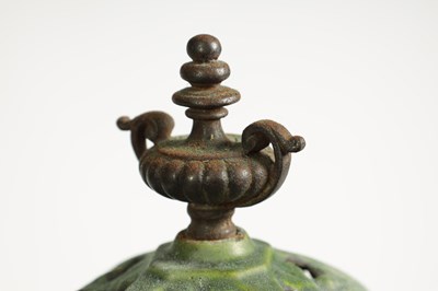 Lot 601 - A 19TH CENTURY CAST IRON OIL BURNER/HEATER