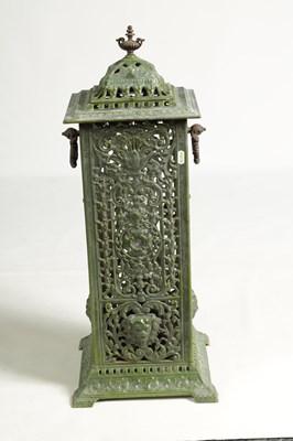 Lot 601 - A 19TH CENTURY CAST IRON OIL BURNER/HEATER