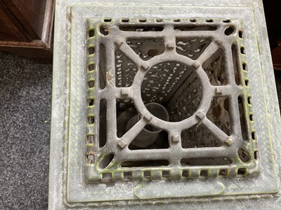 Lot 601 - A 19TH CENTURY CAST IRON OIL BURNER/HEATER