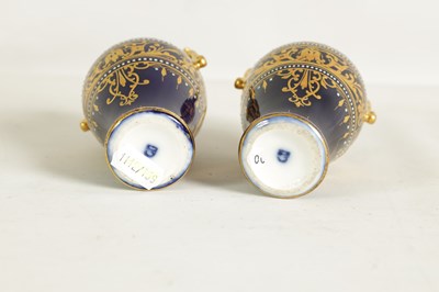 Lot 107 - A PAIR OF LATE 19TH CENTURY VIENNA STYLE GILT AND ROYAL BLUE GROUND TWO-HANDLED CABINET VASES