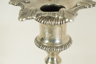 Lot 247 - A FINE SET OF FOUR GEORGE III LARGE CAST SILVER TABLE CANDLE STICKS IN THE ROCOCO MANNER
