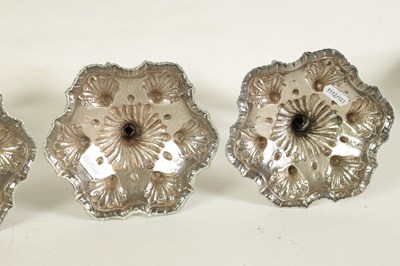Lot 247 - A FINE SET OF FOUR GEORGE III LARGE CAST SILVER TABLE CANDLE STICKS IN THE ROCOCO MANNER