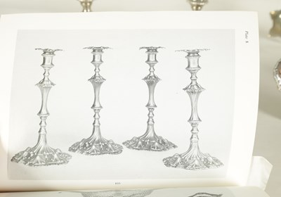 Lot 247 - A FINE SET OF FOUR GEORGE III LARGE CAST SILVER TABLE CANDLE STICKS IN THE ROCOCO MANNER