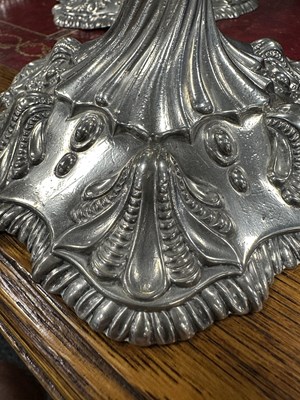 Lot 247 - A FINE SET OF FOUR GEORGE III LARGE CAST SILVER TABLE CANDLE STICKS IN THE ROCOCO MANNER
