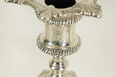 Lot 247 - A FINE SET OF FOUR GEORGE III LARGE CAST SILVER TABLE CANDLE STICKS IN THE ROCOCO MANNER