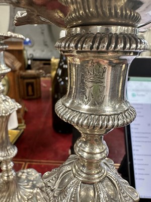 Lot 247 - A FINE SET OF FOUR GEORGE III LARGE CAST SILVER TABLE CANDLE STICKS IN THE ROCOCO MANNER
