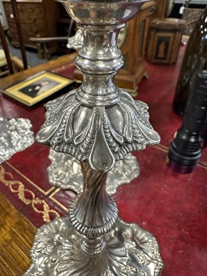 Lot 247 - A FINE SET OF FOUR GEORGE III LARGE CAST SILVER TABLE CANDLE STICKS IN THE ROCOCO MANNER