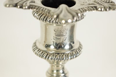 Lot 247 - A FINE SET OF FOUR GEORGE III LARGE CAST SILVER TABLE CANDLE STICKS IN THE ROCOCO MANNER