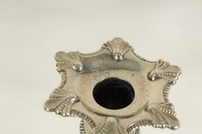Lot 247 - A FINE SET OF FOUR GEORGE III LARGE CAST SILVER TABLE CANDLE STICKS IN THE ROCOCO MANNER