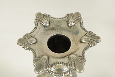 Lot 247 - A FINE SET OF FOUR GEORGE III LARGE CAST SILVER TABLE CANDLE STICKS IN THE ROCOCO MANNER