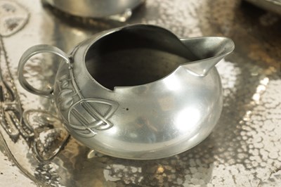 Lot 573 - AN EARLY 20TH CENTURY ARCHIBALD KNOX FOR LIBERTY AND CO. TUDRIC PEWTER TEA SET