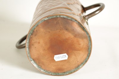Lot 575 - AN ARTS AND CRAFTS COPPER TWO HANDLED VASE