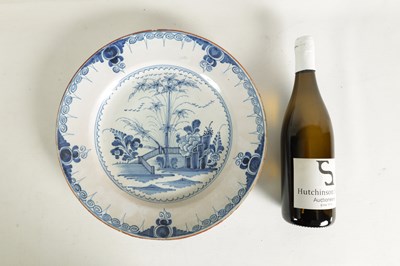 Lot 69 - AN 18TH-CENTURY DELFT BLUE AND WHITE PLATE