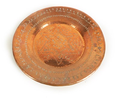 Lot 560 - AN ARTS AND CRAFTS HAMMERED COPPER HANGING CHARGER