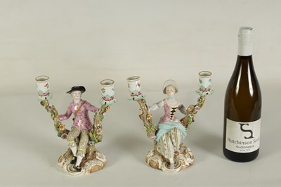 Lot 68 - A PAIR OF MID/LATE 19TH CENTURY MEISSEN FIGURAL TWO-BRANCH CANDELABRA