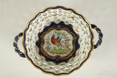 Lot 30 - A 19TH CENTURY FIRST PERIOD WORCESTER TYPE TWO-HANDLED LATTICEWORK BASKET