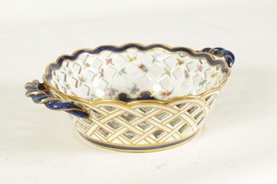 Lot 30 - A 19TH CENTURY FIRST PERIOD WORCESTER TYPE TWO-HANDLED LATTICEWORK BASKET