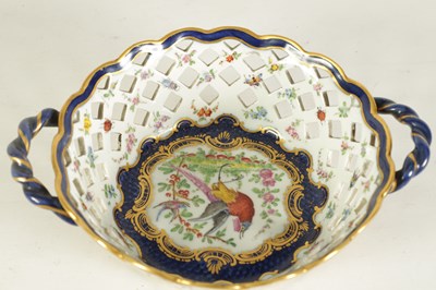 Lot 30 - A 19TH CENTURY FIRST PERIOD WORCESTER TYPE TWO-HANDLED LATTICEWORK BASKET