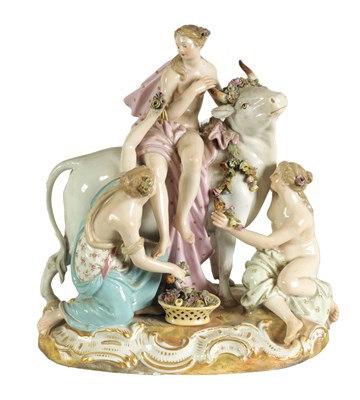 Lot 49 - A 19TH CENTURY MEISSEN FIGURE GROUP OF A BULL WITH A SEATED LADY RIDER AND A FLOWER SELLER