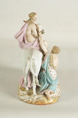 Lot 80 - A 19TH CENTURY MEISSEN FIGURE GROUP OF A BULL WITH A SEATED LADY RIDER AND A FLOWER SELLER