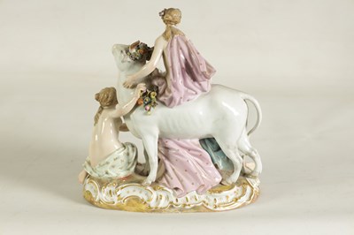 Lot 80 - A 19TH CENTURY MEISSEN FIGURE GROUP OF A BULL WITH A SEATED LADY RIDER AND A FLOWER SELLER