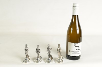 Lot 354 - A SET OF FOUR LARGE SILVER FIGURAL MENU HOLDERS
