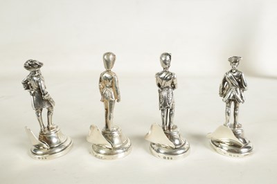 Lot 354 - A SET OF FOUR LARGE SILVER FIGURAL MENU HOLDERS