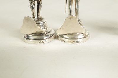 Lot 354 - A SET OF FOUR LARGE SILVER FIGURAL MENU HOLDERS