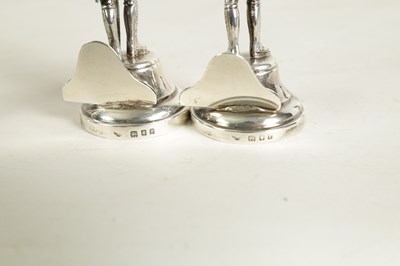 Lot 354 - A SET OF FOUR LARGE SILVER FIGURAL MENU HOLDERS