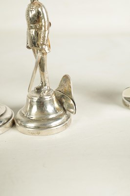 Lot 354 - A SET OF FOUR LARGE SILVER FIGURAL MENU HOLDERS