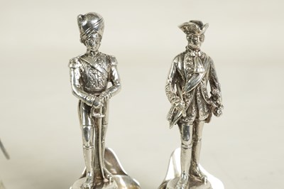 Lot 354 - A SET OF FOUR LARGE SILVER FIGURAL MENU HOLDERS