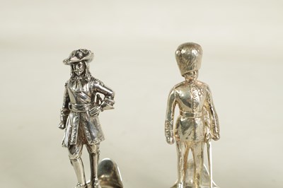 Lot 354 - A SET OF FOUR LARGE SILVER FIGURAL MENU HOLDERS