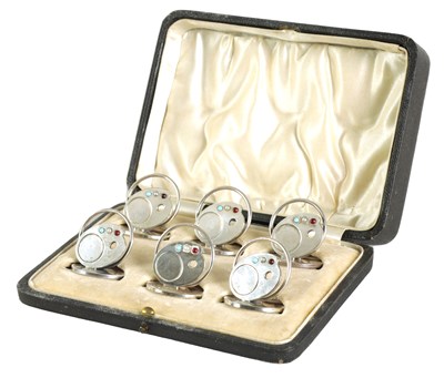 Lot 339 - A CASED SET OF SIX SILVER, TURQUOISE, PEARL AND RUBY ARTIST’S PALLET MENU HOLDERS